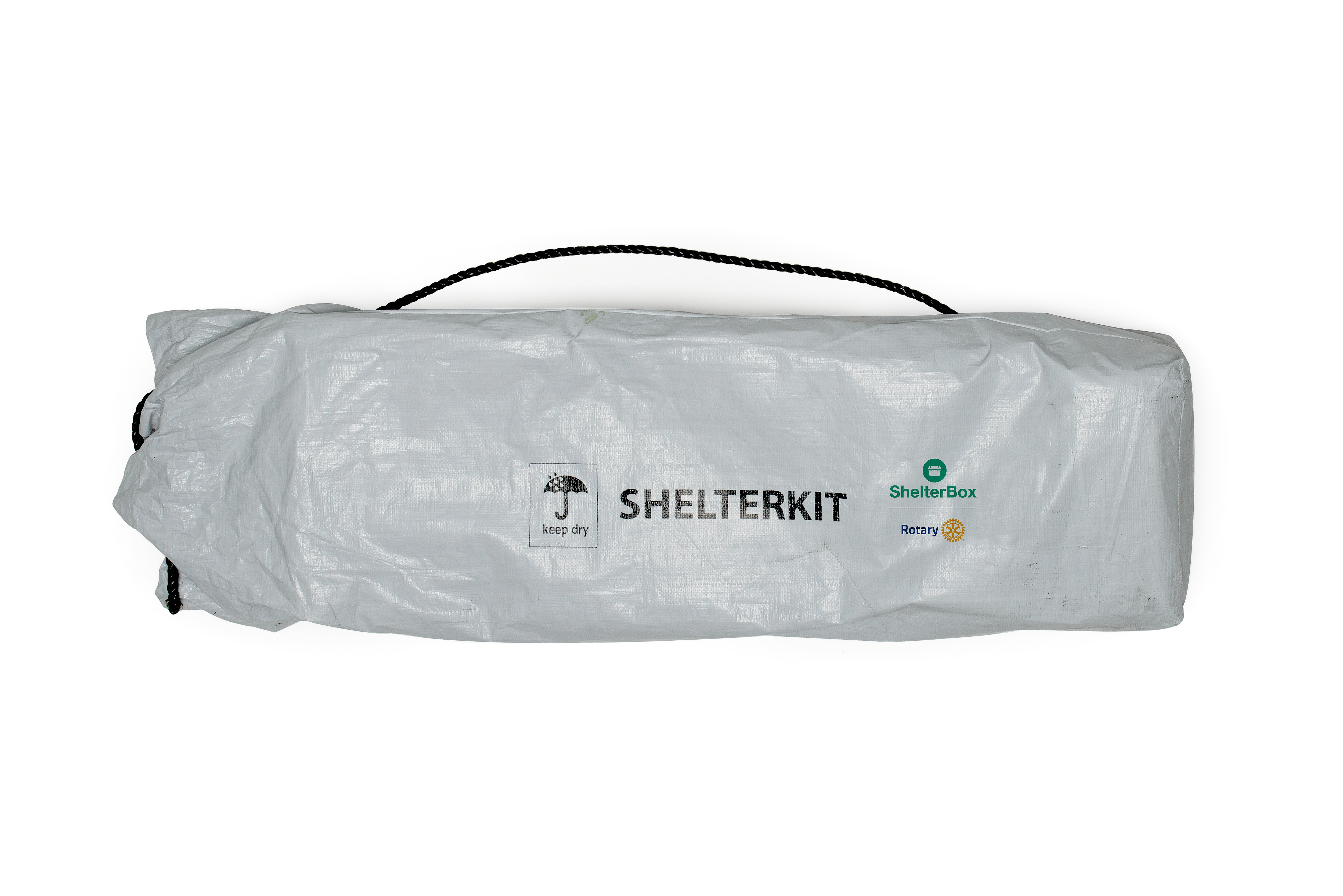 A ShelterKit containing disaster relief items, including tarpaulins, rope and tools, to help families rebuild after disaster